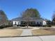 Community clubhouse features beautiful landscaping and ample walkway in a well maintained neighborhood at 9450 Knollcrest Blvd, Alpharetta, GA 30022