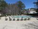 Community pool with several lounge chairs available for residents to sit and enjoy the outdoor weather at 9450 Knollcrest Blvd, Alpharetta, GA 30022