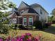 Two-story home with well-maintained lawn, brick facade and fresh landscaping at 9450 Knollcrest Blvd, Alpharetta, GA 30022