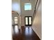 Bright foyer with hardwood floors, staircase, and elegant double door entry at 9450 Knollcrest Blvd, Alpharetta, GA 30022