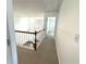 Hallway with railing and view to the living room below at 9450 Knollcrest Blvd, Alpharetta, GA 30022