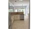 Bright kitchen area showcasing a stainless steel dishwasher and plentiful natural light at 9450 Knollcrest Blvd, Alpharetta, GA 30022
