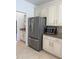 Well-lit kitchen featuring stainless steel appliances and granite countertops at 9450 Knollcrest Blvd, Alpharetta, GA 30022