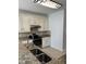 Modern kitchen with granite countertops, a stainless steel sink, and stainless steel appliances at 9450 Knollcrest Blvd, Alpharetta, GA 30022