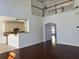 Open-concept living area with high ceilings and railing overlooking the kitchen at 9450 Knollcrest Blvd, Alpharetta, GA 30022
