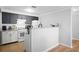 Bright kitchen with white and gray cabinets, granite countertops, and tile backsplash at 4307 Orchard Park Ct # A, Stone Mountain, GA 30083