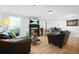 Open living room features fireplace, and hardwood floors at 4307 Orchard Park Ct # A, Stone Mountain, GA 30083