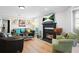 Bright living room with fireplace, hardwood floors, and large windows at 4307 Orchard Park Ct # A, Stone Mountain, GA 30083