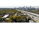 Aerial view of property with Atlanta skyline in background, train, and nearby trees at 791 Wylie Se St # 1111, Atlanta, GA 30316