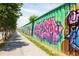 A graffiti wall running alongside a sidewalk along the Atlanta BeltLine trail at 791 Wylie Se St # 1111, Atlanta, GA 30316