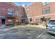 Building exterior with brick facade, balconies, parking spaces, and visible unit numbers at 791 Wylie Se St # 1111, Atlanta, GA 30316