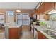 Kitchen with island seating, brick accents, and a seamless flow into the living space at 791 Wylie Se St # 1111, Atlanta, GA 30316