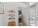 Convenient laundry room with shelving, side-by-side washer and dryer, and access to outdoor area at 791 Wylie Se St # 1111, Atlanta, GA 30316