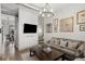 Comfortable living room area featuring a large screen television and industrial-style lighting fixture at 791 Wylie Se St # 1111, Atlanta, GA 30316