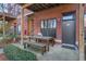 Charming patio with seating area, brick facade, and cozy outdoor ambiance at 1111 at 791 Wylie Se St # 1111, Atlanta, GA 30316