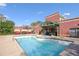 Outdoor pool with brick buildings, lush landscaping, and comfortable lounge areas at 791 Wylie Se St # 1111, Atlanta, GA 30316