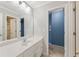 Bathroom featuring a single sink vanity and a doorway leading to another bathroom space at 1414 Lynchburg Trce, Grayson, GA 30017