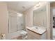 The bathroom has a shower-tub combination, a single sink vanity and tile flooring at 1414 Lynchburg Trce, Grayson, GA 30017