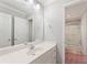 Bathroom with a single vanity and a doorway leading to the shower and toilet area at 1414 Lynchburg Trce, Grayson, GA 30017