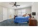 Comfortable bedroom featuring a ceiling fan, a trundle bed, and plantation shutters at 1414 Lynchburg Trce, Grayson, GA 30017