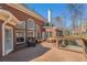 Spacious outdoor deck featuring wicker furniture, with beautiful arched windows looking into the home at 1414 Lynchburg Trce, Grayson, GA 30017