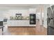 Modern kitchen with stainless steel appliances and white cabinets at 1414 Lynchburg Trce, Grayson, GA 30017