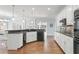 Bright kitchen features granite countertops, modern appliances, and hardwood floors at 1414 Lynchburg Trce, Grayson, GA 30017