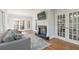 Comfortable living room with a fireplace and french doors at 1414 Lynchburg Trce, Grayson, GA 30017