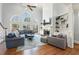 Spacious living room with high ceilings, built-in shelves, and large windows at 1414 Lynchburg Trce, Grayson, GA 30017