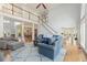 Bright and airy living room with open floor plan and hardwood floors at 1414 Lynchburg Trce, Grayson, GA 30017