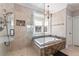 Spa-like bathroom featuring a separate shower, tub, and marble countertops at 1414 Lynchburg Trce, Grayson, GA 30017