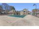 Spacious pool with covered safety cover, and the home in the background on a sunny day at 1414 Lynchburg Trce, Grayson, GA 30017