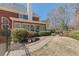 Brick home featuring a walkway through the landscaped backyard at 1414 Lynchburg Trce, Grayson, GA 30017