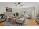 Elegant bedroom features a plush, tufted headboard bed, accent chairs, and a neutral color palette at 1456 Hedgewood Nw Ln, Kennesaw, GA 30152