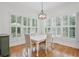 Sunny breakfast nook with plantation shutters offering lots of natural light and seating for four at 1456 Hedgewood Nw Ln, Kennesaw, GA 30152