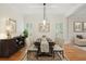 Bright dining room featuring hardwood floors, elegant decor, and natural light at 1456 Hedgewood Nw Ln, Kennesaw, GA 30152