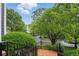 A view from the front stairs of the lush front yard and landscaping on a sunny day at 1456 Hedgewood Nw Ln, Kennesaw, GA 30152