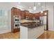 Modern kitchen with stainless steel appliances, granite countertops, and a central island at 1456 Hedgewood Nw Ln, Kennesaw, GA 30152