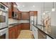 Gourmet kitchen features stainless steel appliances, granite countertops, and custom wood cabinetry at 1456 Hedgewood Nw Ln, Kennesaw, GA 30152