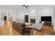Comfortable living room featuring a stone fireplace and hardwood floors at 1456 Hedgewood Nw Ln, Kennesaw, GA 30152