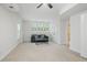 Spacious living room with neutral carpet, complemented by a plush sofa and natural light at 1456 Hedgewood Nw Ln, Kennesaw, GA 30152