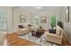 Cozy living room with comfortable seating, hardwood floors, and bright windows at 1456 Hedgewood Nw Ln, Kennesaw, GA 30152