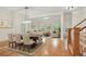 Open-concept living and dining area with hardwood floors and abundant natural light at 1456 Hedgewood Nw Ln, Kennesaw, GA 30152