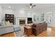 Cozy living room with fireplace, hardwood floors, and ample seating at 1456 Hedgewood Nw Ln, Kennesaw, GA 30152