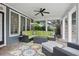 Covered patio with wicker furniture set on a stone paver floor at 1456 Hedgewood Nw Ln, Kennesaw, GA 30152