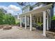 Expansive outdoor patio with comfortable seating, a fire pit, and a well-manicured lawn at 1456 Hedgewood Nw Ln, Kennesaw, GA 30152