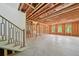 Unfinished basement with exposed wood framing offers potential for customization and expansion, waiting for your personal touch at 155 Westbrook St, Buford, GA 30518