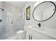 Elegant bathroom featuring a glass shower with marble tile and a sleek, modern vanity at 155 Westbrook St, Buford, GA 30518