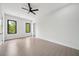 Bright, neutral bedroom featuring two windows, recessed lighting, and a ceiling fan at 155 Westbrook St, Buford, GA 30518
