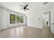 Bright bedroom featuring recessed lighting and three windows offering wooded views at 155 Westbrook St, Buford, GA 30518